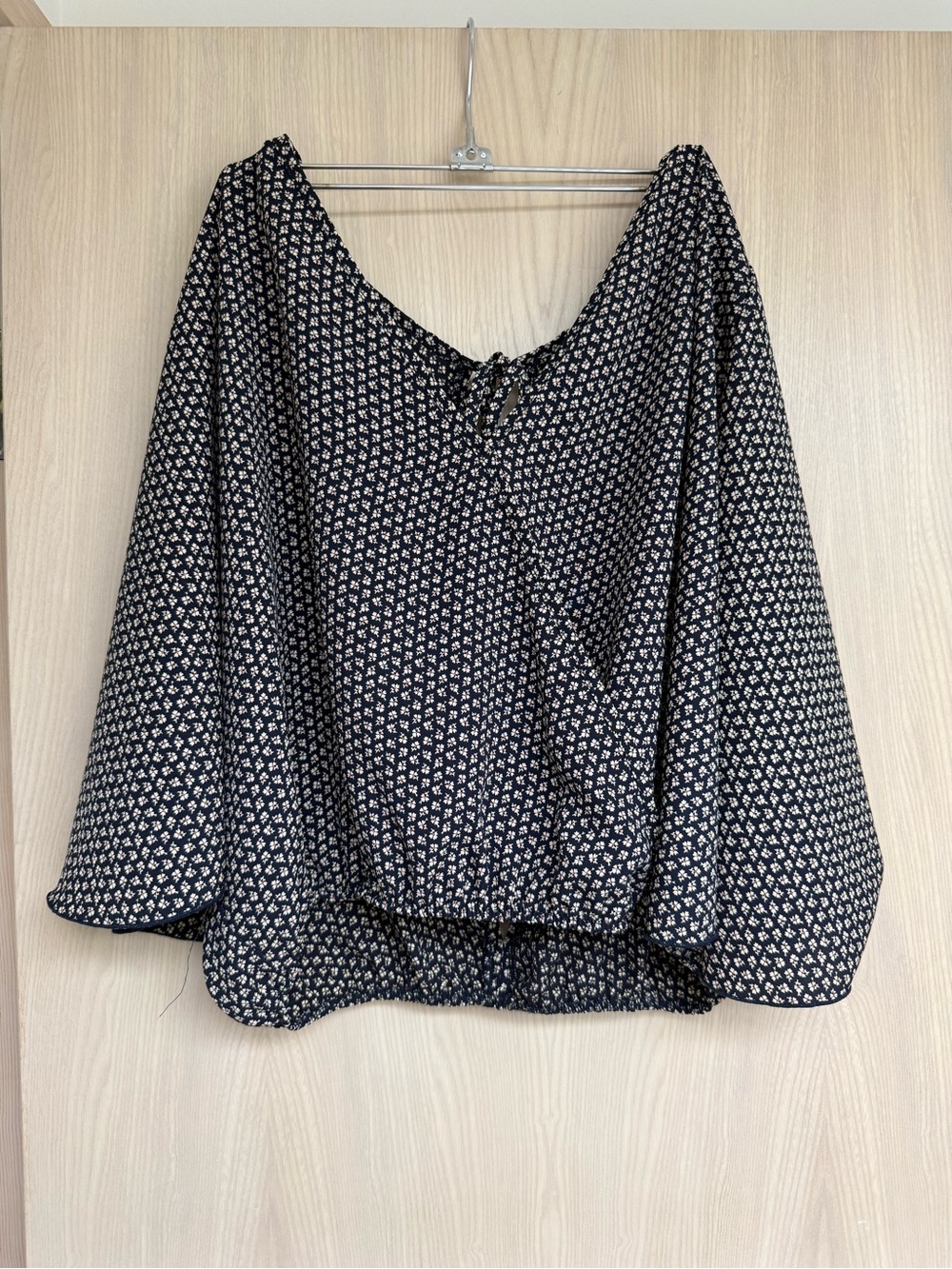 Black & White Floral blouse with bell sleeves, semi open back, and elastic waist